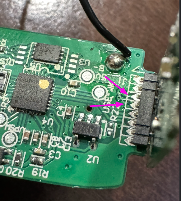 The identified debug pins on the connector between the main PCB and the daughter board.