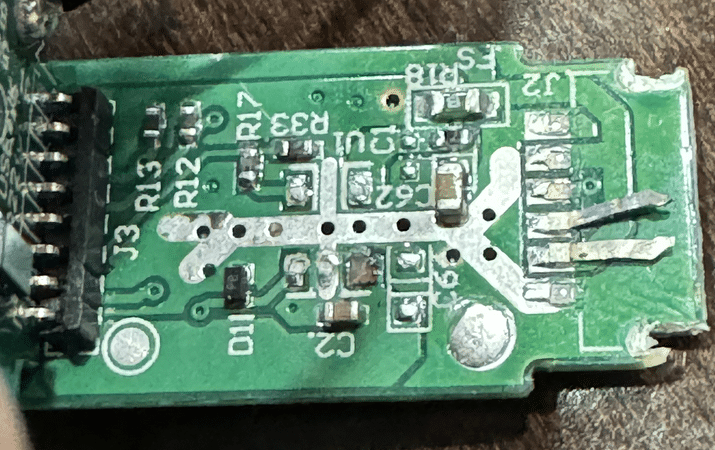 The daughter board is responsible for power and other functionality. Notice the destroyed USB-C connector on the right.